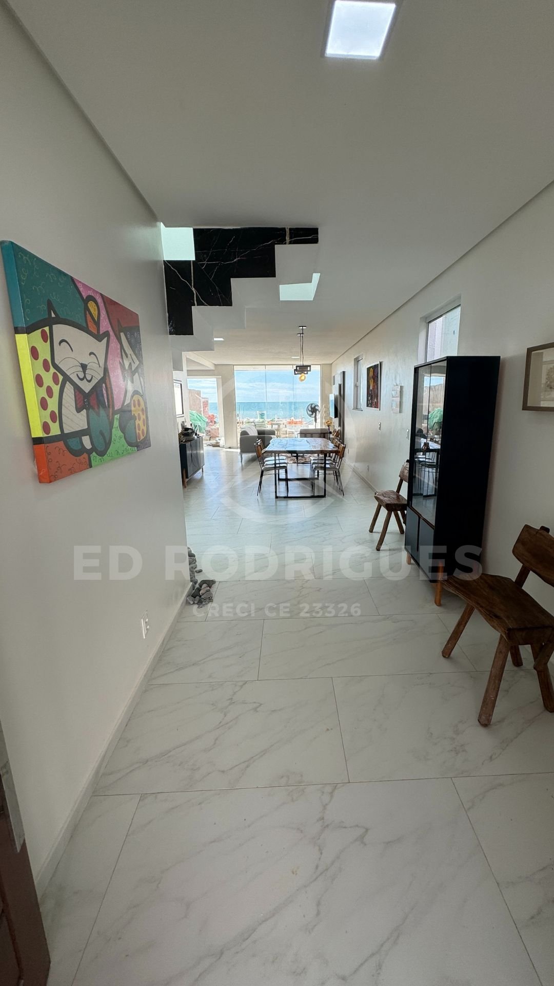 casa-venda-praia-pacheco-hall-decorado-1